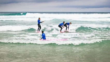 Learning how to surf at our French surf camps